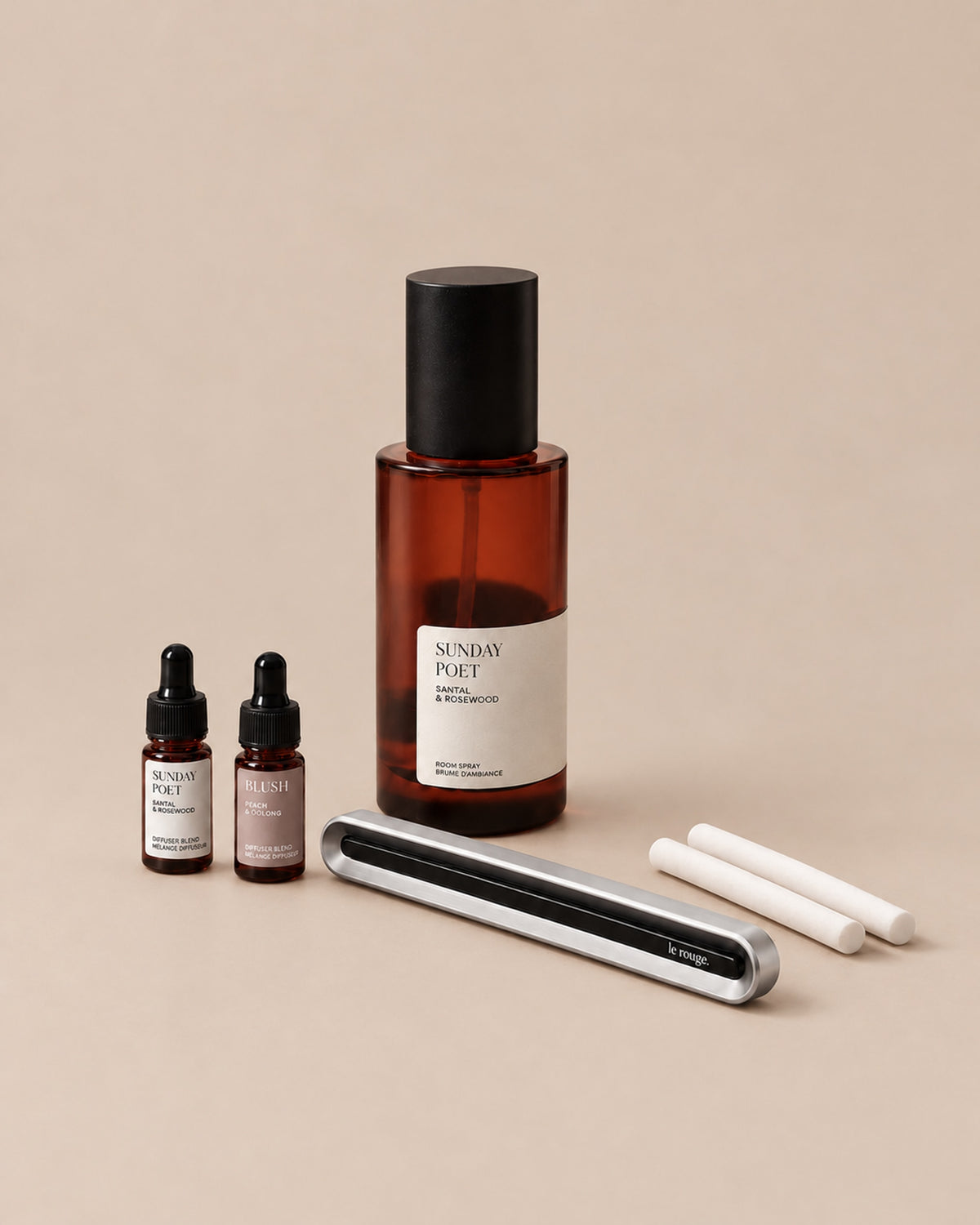 Home and Drive gift set with Sunday Poet room spray and complete LuxeDrive set on a plain beige background
