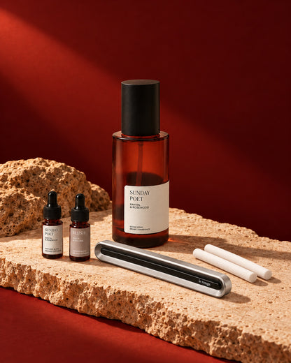 Home and Drive gift set with Sunday Poet room spray and complete LuxeDrive set styled on stone with a red backdrop