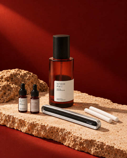 Home and Drive gift set with Sunday Poet room spray and complete LuxeDrive set styled on stone with a red backdrop