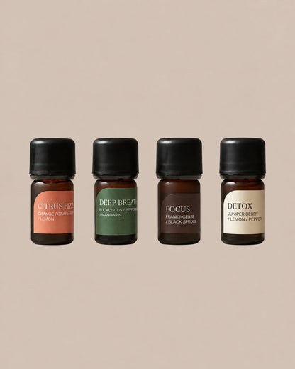 The Essential Quartet: Citrus Fizz, Deep Breath, Focus and Detox, four 5ml diffuser blends on a clean beige background.