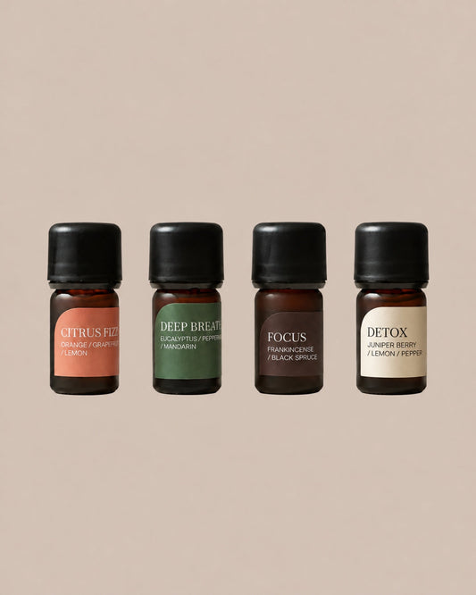 The Essential Quartet: Citrus Fizz, Deep Breath, Focus and Detox, four 5ml diffuser blends on a clean beige background.